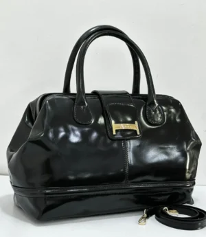 Black patent leather doctor bag with gold buckle logo plate and rolled handles, Nigeria Black patent leather doctor bag with gold buckle logo plate and rolled handles, Nigeria