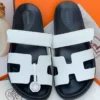 Hermès Chypre White & Black Slide Sandals Hermès Chypre White & Black H-Cutout Slide Sandals