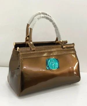 bronze-patent-leather-top-handle-bag-turquoise-medallion-gold-frame-nigeria Roberto Cavalli Bronze patent leather top handle bag with turquoise stone medallion gold frame hardware Nigeria