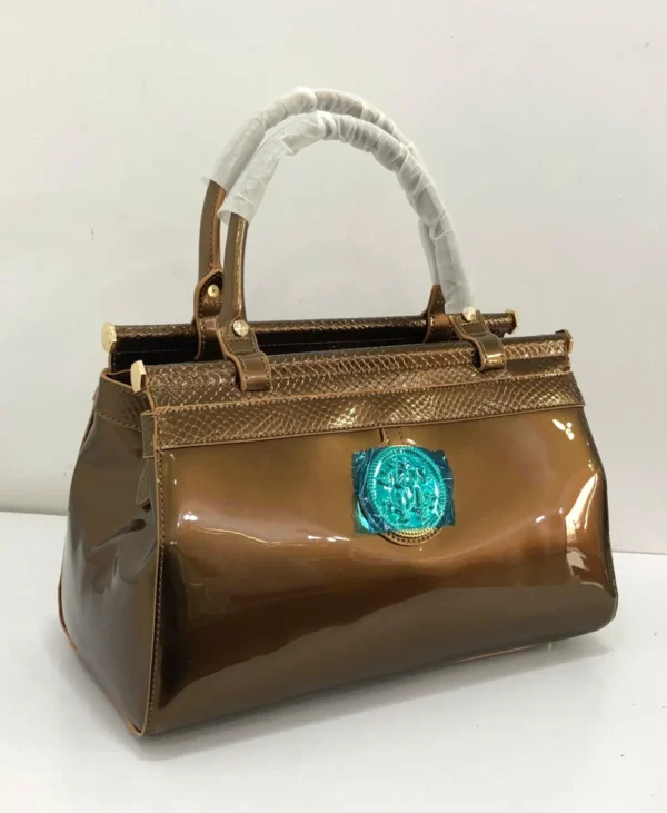 bronze-patent-leather-top-handle-bag-turquoise-medallion-gold-frame-nigeria Roberto Cavalli Bronze patent leather top handle bag with turquoise stone medallion gold frame hardware Nigeria