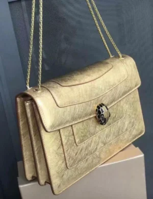 bvlgari-serpenti-forever-chain-flap-gold-metallic-snake-clasp-nigeria Bvlgari Serpenti Forever chain flap bag gold metallic with black and white snake head clasp Nigeria