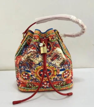 bucket-bag-red-multicolor-print-gold-padlock-nigeria.webpDolce and Gabbana Carretto Siciliano print bucket bag red multicolor with gold DG padlock and red drawstring Nigeria