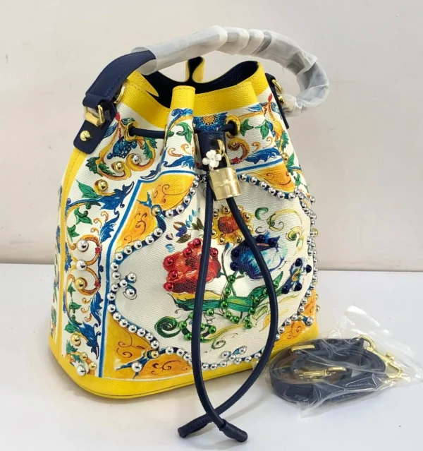dolce-gabbana-maiolica-bucket-bag-yellow-white-studded-multicolor-beads-gold-padlock-nigeria Dolce and Gabbana Carretto Siciliano print bucket bag red multicolor with gold DG padlock and red drawstring Nigeria