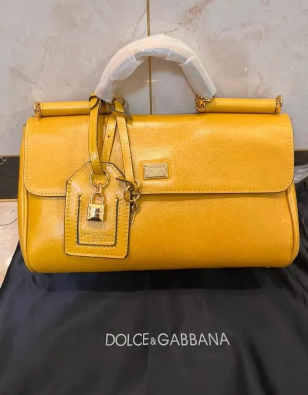 dolce-gabbana-sicily-east-west-top-handle-bag-mustard-yellow-gold-lock-charm-nigeria Dolce Gabbana Sicily East West top handle bag mustard yellow leather with gold DG plate lock charm and dustbag Nigeria