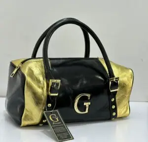 Gilda Ferretti Boston bag black and gold metallic leather with large gold G logo Italian-made Nigeria