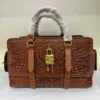 givenchy-antigona-lock-top-handle-bag-brown-leather-gold-4g-lock-floral-emboss-nigerian givenchy-antigona-lock-top-handle-bag-brown-leather-gold-4g-lock-floral-emboss-nigerian