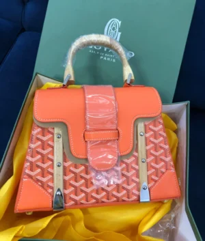 goyard-saigon-top-handle-bag-orange-chevron-canvas-wood-handles-nigeria Goyard Saigon top handle bag orange chevron canvas with natural wood handles silver hardware in branded box Nigeria