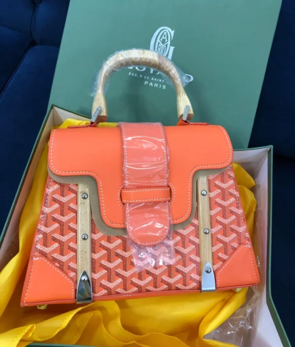 Goyard Saigon top handle bag orange chevron canvas with natural wood handles silver hardware in branded box Nigeria