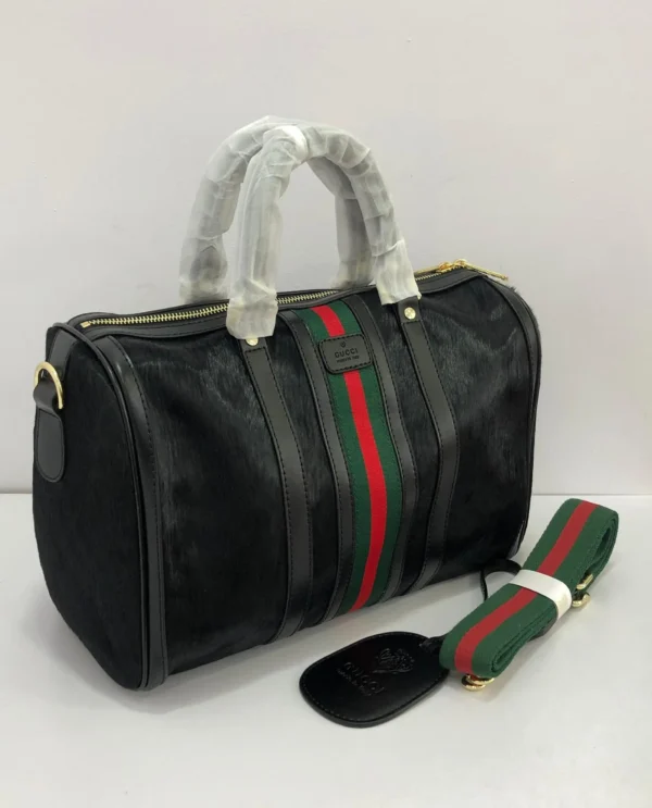 gucci-web-stripe-black-boston-top-handle-bag-pamzy-wears.webp Gucci web stripe black Boston top handle bag red green stripe gold zipper – Pamzy Wears Lagos