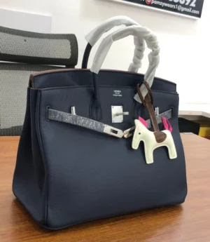 Hermès Birkin 30 navy blue Togo leather with palladium hardware white Rodeo horse charm and pink tassel Nigeria