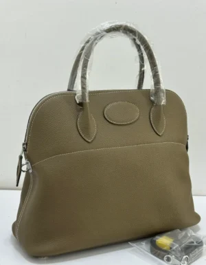 Hermes Bolide style tote bag taupe etoupe pebbled leather with oval medallion detail silver hardware and shoulder strap Nigeria