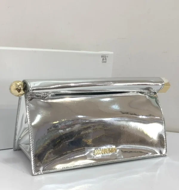 jacquemus-le-bambino-long-silver-mirror-metallic-gold-hardware-nigeria Jacquemus Le Chiquito silver mirror metallic clutch bag with silver logo and chain strap Nigeria