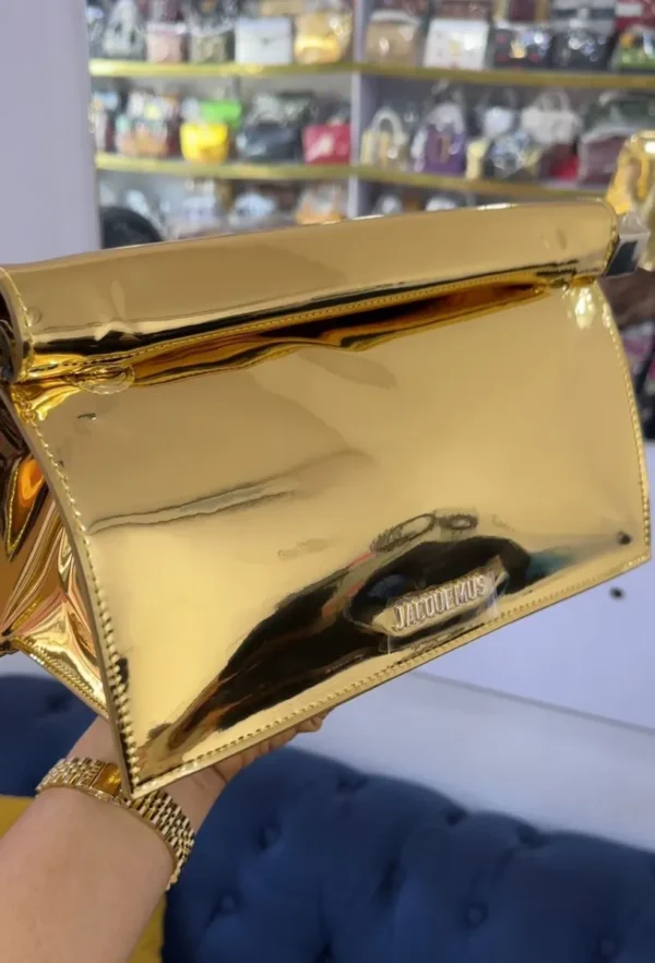 jacquemus-le-chiquito-gold-mirror-metallic-clutch-bag-chain-strap-nigeria Jacquemus Le Chiquito gold mirror metallic clutch bag with silver logo and chain strap Nigeria