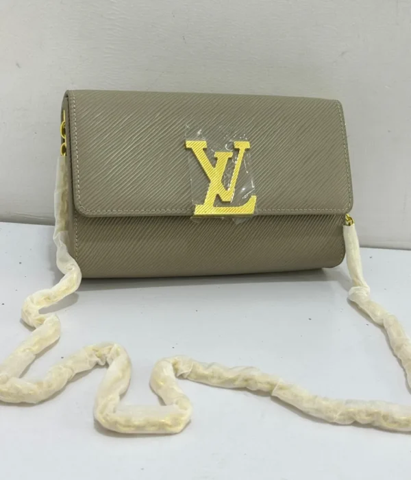 louis-vuitton-louise-chain-pm-grey-galet-epi-leather-oversized-gold-lv-logo-clasp-nigeria Louis Vuitton Louise Chain PM grey galet Epi leather with oversized gold LV logo flip clasp and sliding gold chain Nigeria