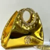 Roberto Cavalli Gold patent leather fan-shaped satchel with gold laurel wreath top handle RC logo and pyramid studs Nigeri