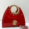 Roberto Cavalli red patent leather fan-shaped satchel with gold laurel wreath top handle RC logo and pyramid studs Nigeria