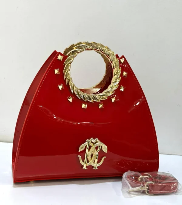 Roberto Cavalli red patent leather fan-shaped satchel with gold laurel wreath top handle RC logo and pyramid studs Nigeria