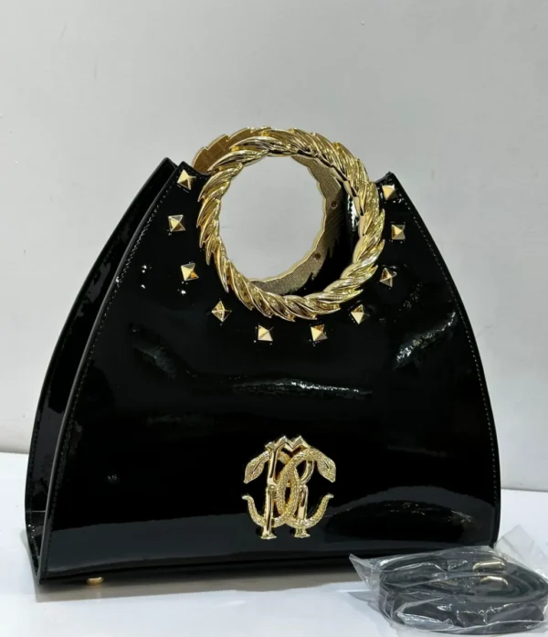 Roberto Cavalli Black patent leather fan-shaped satchel with gold laurel wreath top handle RC logo and pyramid studs Nigeria