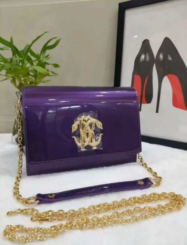 roberto-cavalli-patent-leather-shoulder-bag-purple-gold-rc-logo-chain-nigeria roberto-cavalli-patent-leather-shoulder-bag-purple-gold-rc-logo-chain-nigeria