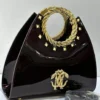 Roberto Cavalli wine patent leather fan-shaped satchel with gold laurel wreath top handle RC logo and pyramid studs Nigeria