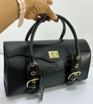 sergio-cerruti-roma-barrel-bag-black-leather-gold-hardware-turn-lock-nigeria Sergio Cerruti Roma barrel bag black leather with gold turn-lock hardware embossed logo and buckle detail Nigeria