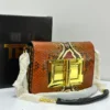 : Tom Ford Natalia crossbody bag in burnt orange python skin with gold turn-lock, Pamzy Wears
