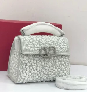 valentino-garavani-pearl-embellished-top-handle-bag-white-silver-vlogo-nigeria valentino-garavani-pearl-embellished-top-handle-bag-white-silver-vlogo-nigeria