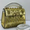 Valentino Vsling gold metallic top handle bag with crystal embellishments Nigeria