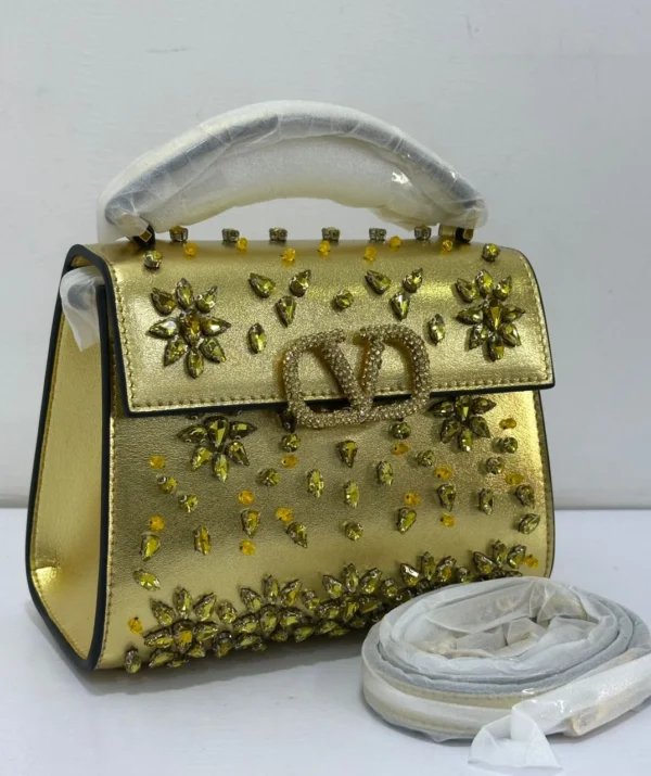 Valentino Vsling gold metallic top handle bag with crystal embellishments Nigeria