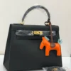 Hermes-black-structured-leather-handbag-gold-turnlock
