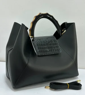 gilda-ferretti-black-leather-sculptural-tote-resin-handle-lagos-nigeria gilda-ferretti-black-leather-sculptural-tote-resin-handle-lagos-nigeria